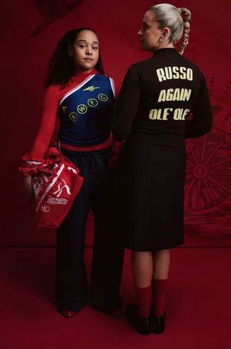 Alessia Russo and Olivia Smith wearing custom Arsenal FC / AWFC jacket, one shoulder top, and AWFC x Good Squish tote bag