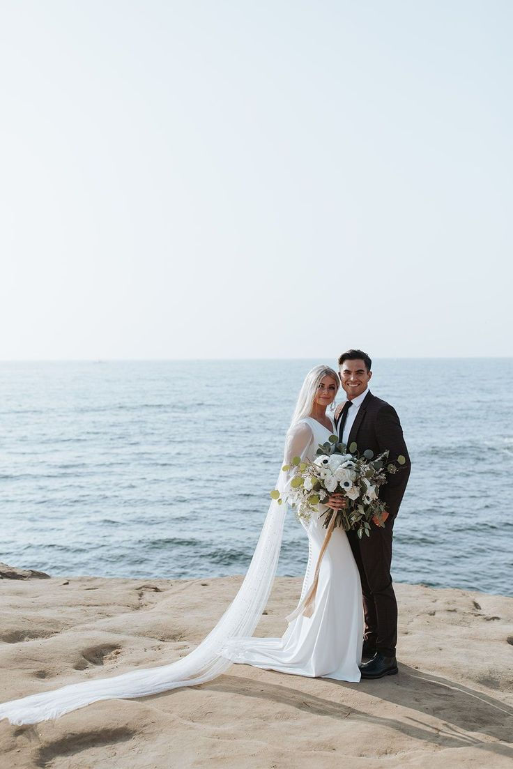 Bride and groom by the sea at a Swedish coastal destination wedding, enquire with Aceline House