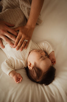 hands holding a newborn baby in sydney