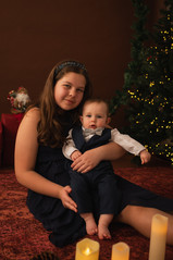 A siblings' portrait under the Christmas tree