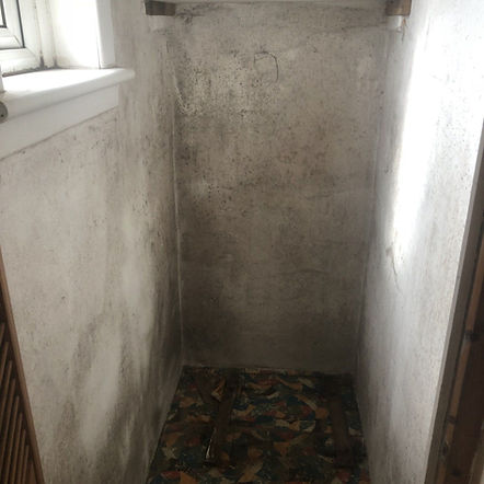 Signs of damp on white wall in home