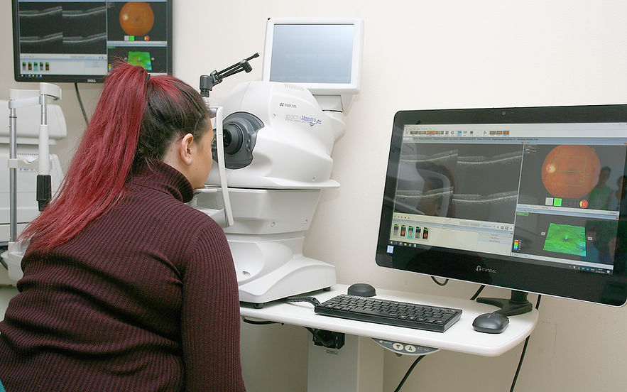 woman in Sam Baird's Opticians having a visual stress assessment