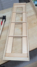 Friction fit balsa wood members help create spacers for the canvas to sit within the frame. 