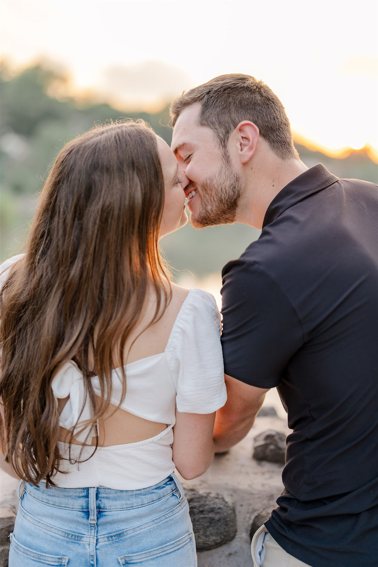 Engaged couple shares a  romantic kiss at Onondaga park, Syracuse, NY