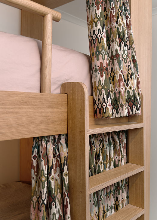 Kids bunk bed ladder and curtain.