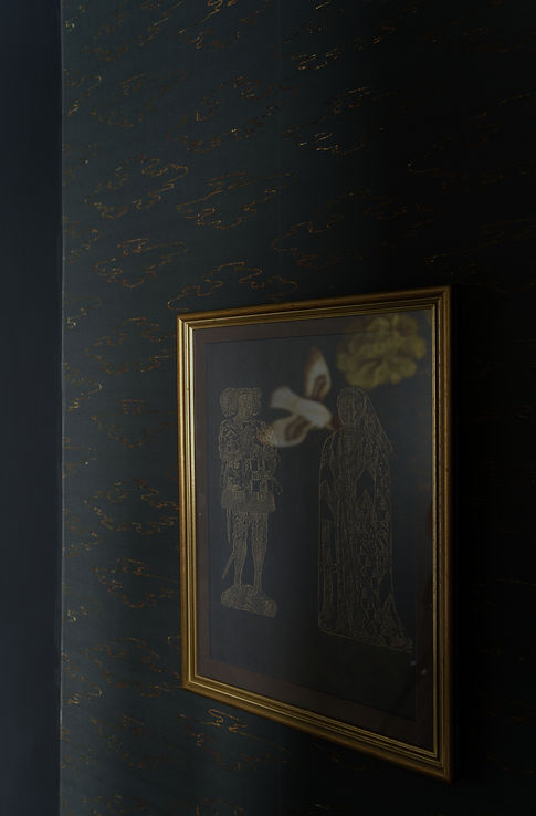 Moody powder room wallpaper and art
