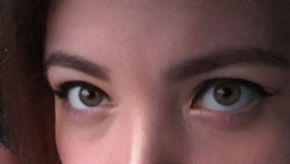 Woman's hazel eyes beaconing you closer 