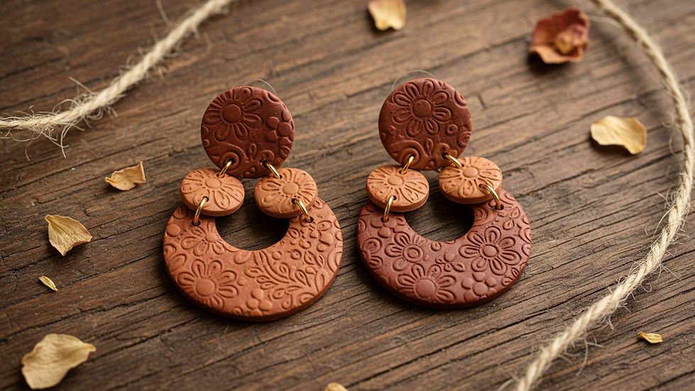 Close-up view of colorful artisan handmade earrings on a rustic wooden surface