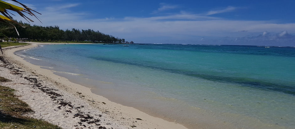 White sandy beach in Mauritius with clear turquoise water