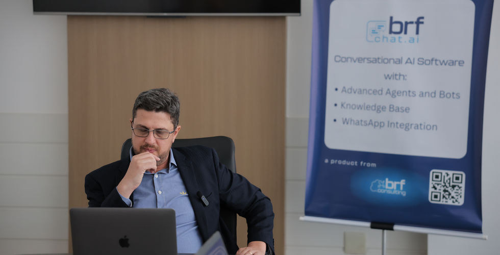 Angelo Buss watches a presentation on his laptop. (Source: BRF Consulting, LLC)