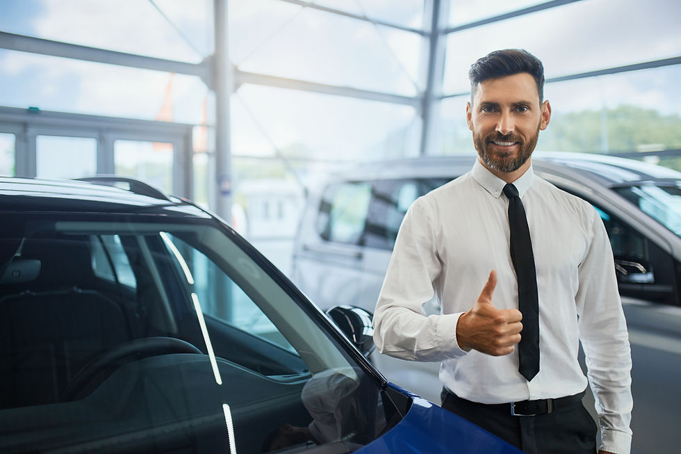 handsome-man-showing-thumb-up-while-buying-car-salon 1