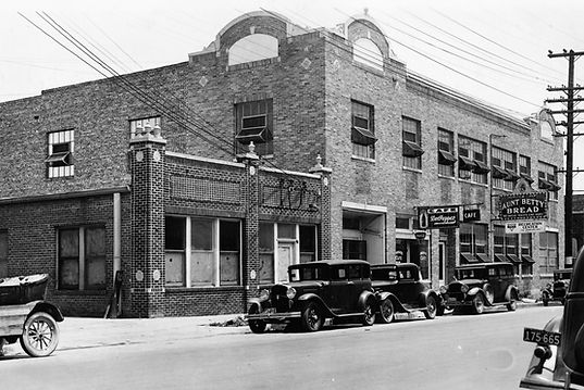 Historic building with cars parked out front