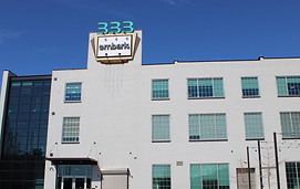 White building with 333 and embark signage