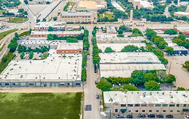 Aerial view of a city with buildings and roads.