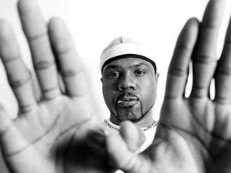 Wu-Tang producer Mathematics, known for his work on The Saga Continues and the iconic Wu-Tang logo.