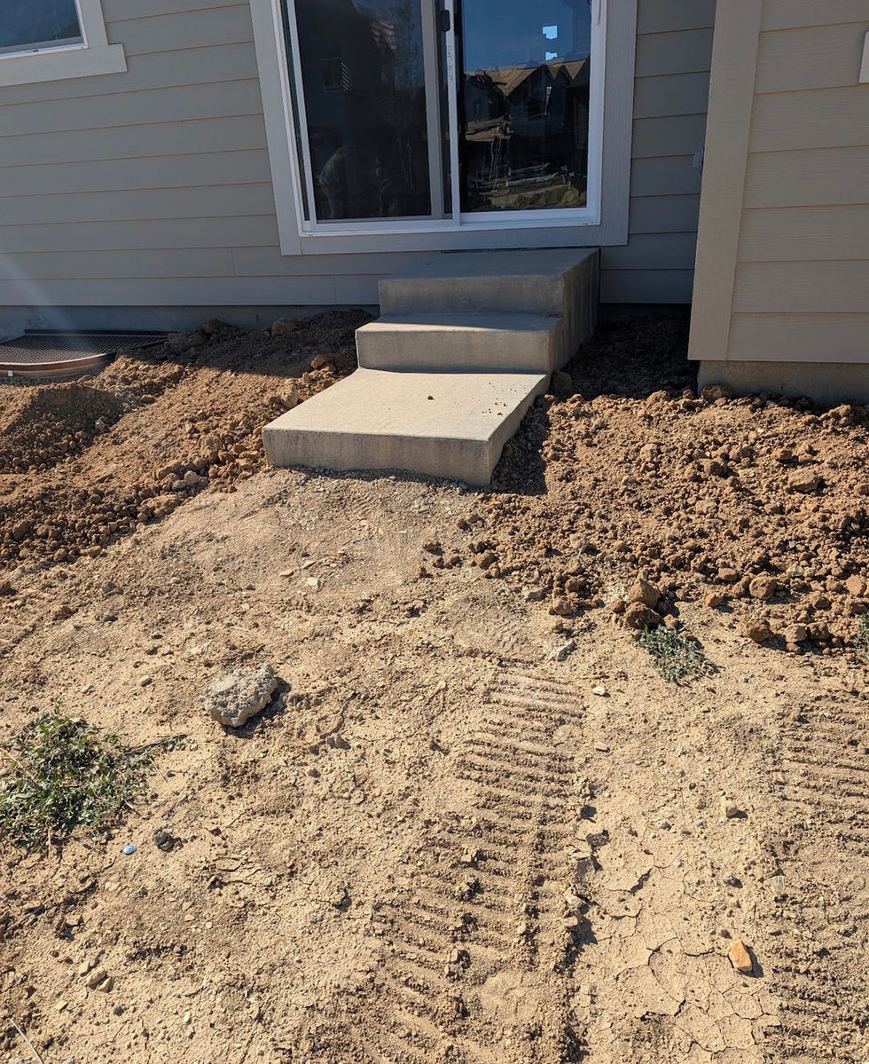 Bare residential backyard before professional landcaping and sod installation