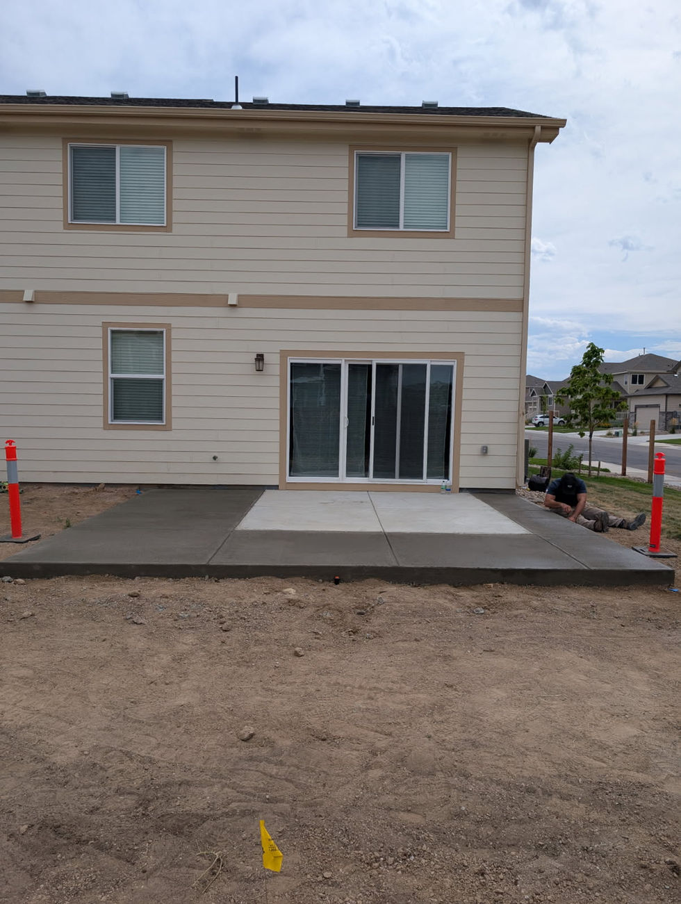 Concrete patio extension in Colorado by Blue Ridge Landscape