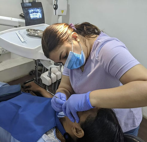 Dentist performing root canal treatment on a patient at Dantoon Dental Clinic, Whitefield