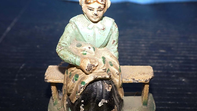 Cast Iron Doorstop - Lady on a Bench