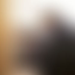 Racquet sports business owner working alone on laptop weighing a difficult decision