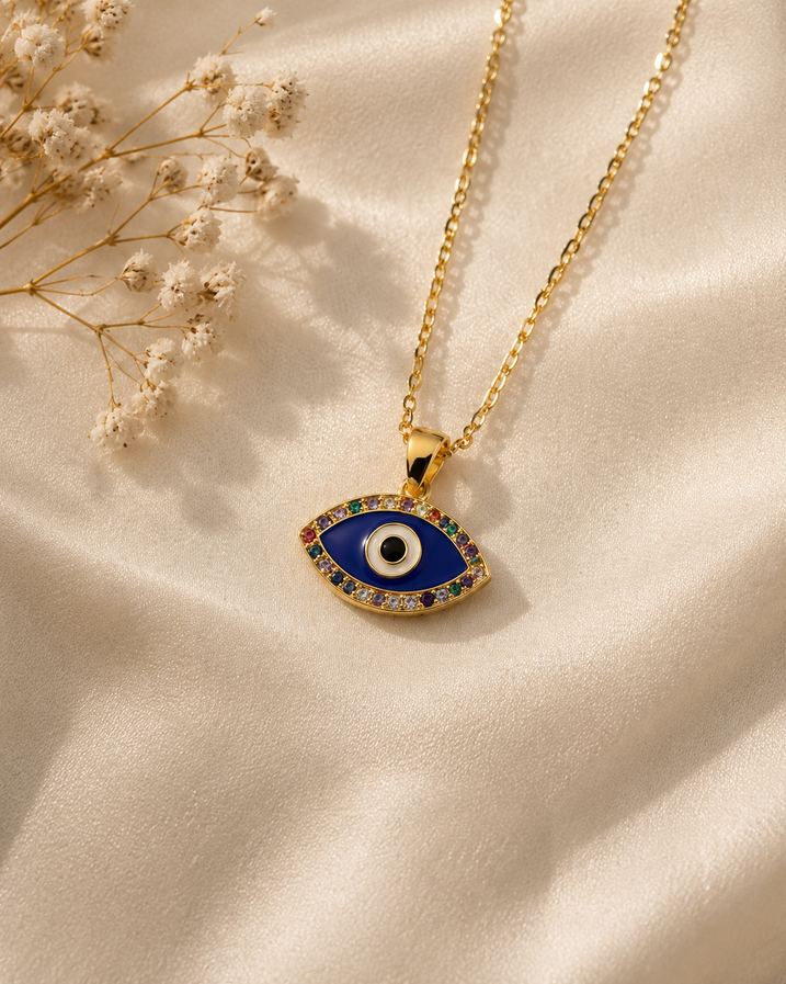Gold-tone evil eye pendant with royal blue enamel and multicolour crystal border