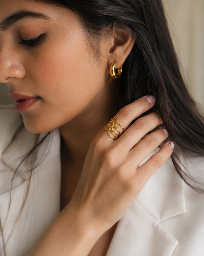 Model wearing adjustable gold spiral ring