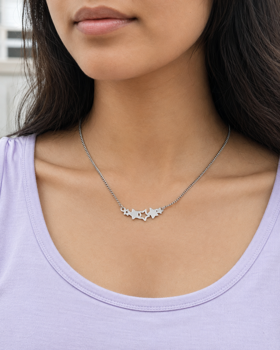 Short silver-tone star necklace product close-up