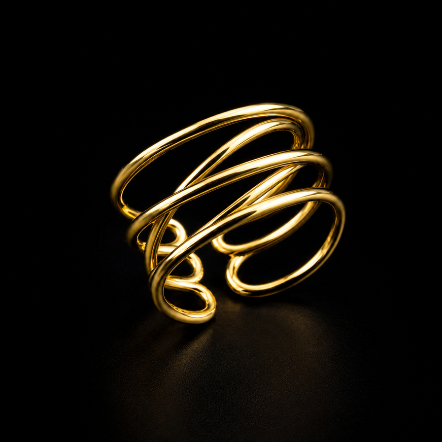 Gold spiral coil ring on dark background