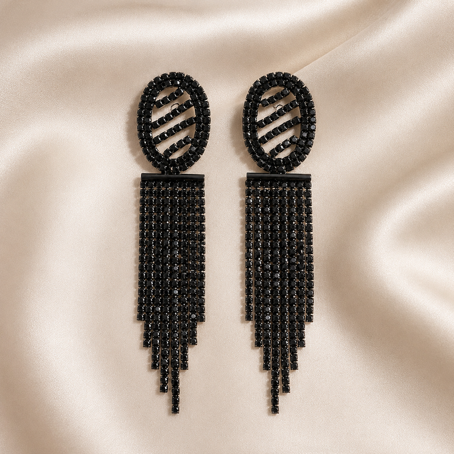 Close-up of black stone fringe earrings styled for a cocktail party