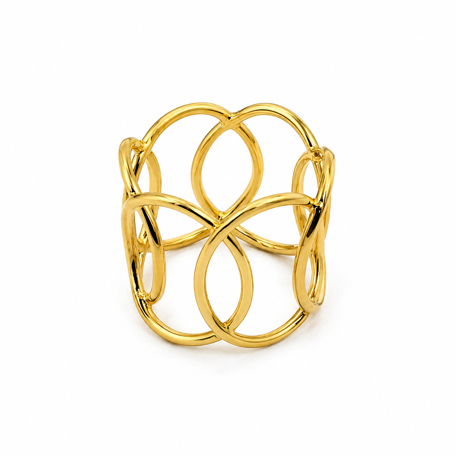 Gold lattice brass ring with geometric cut-out band on white