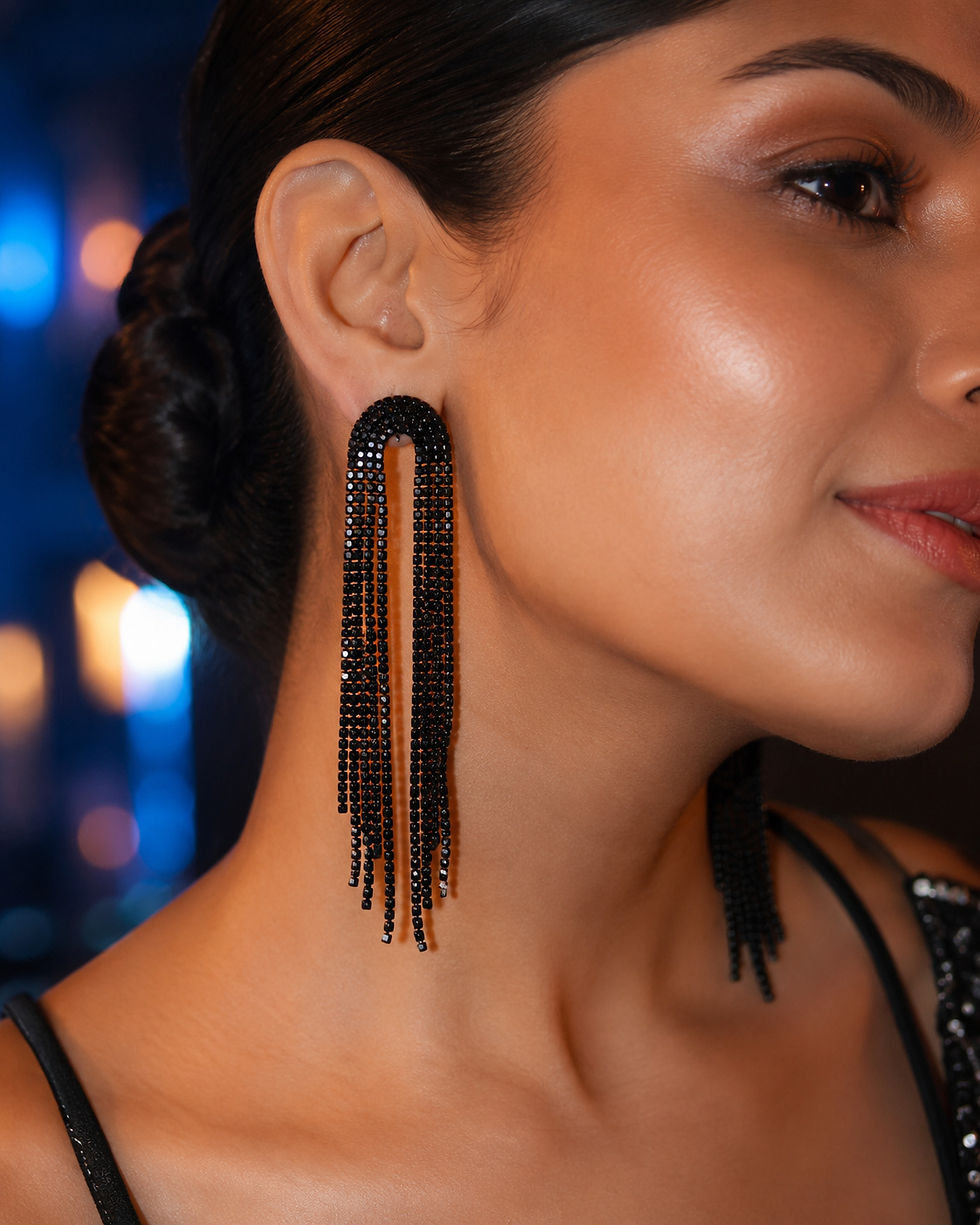 Indian woman wearing Midnight Arc black tassel earrings at an evening party