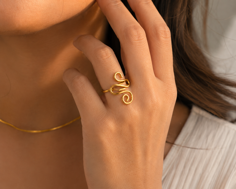 Adjustable gold snake ring worn on hand