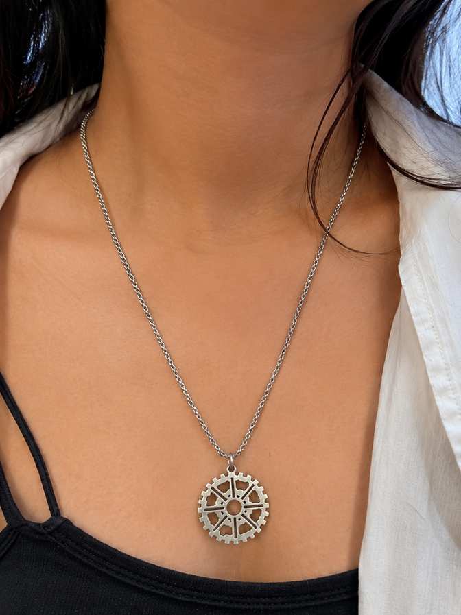Indian model wearing geometric gear wheel stainless steel necklace