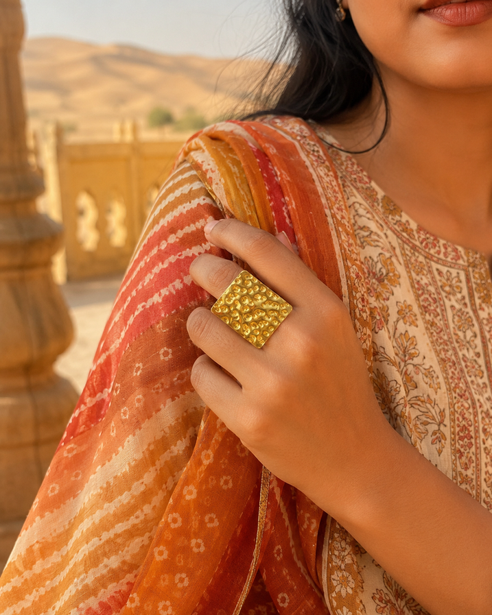 Model wearing square hammered gold brass statement ring