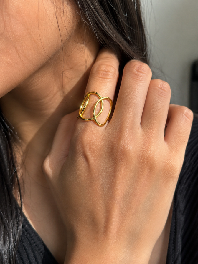 Model wearing gold lattice brass ring