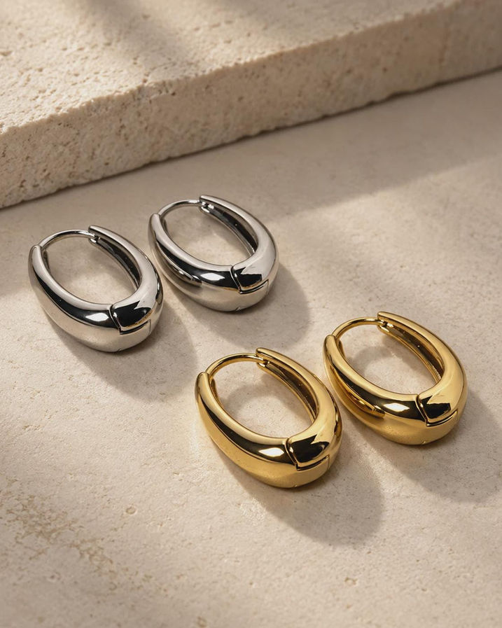 Chunky hoop earrings in gold and silver plated finish, oval huggie hoops by FiveChiQ
