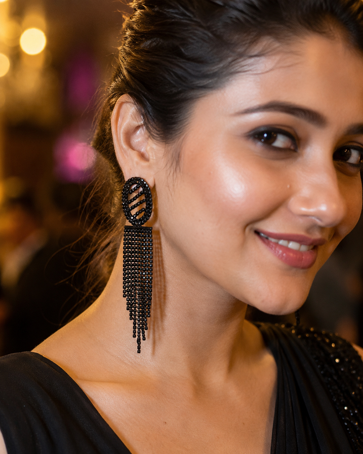 Woman wearing Midnight Lines black fringe earrings at an evening party