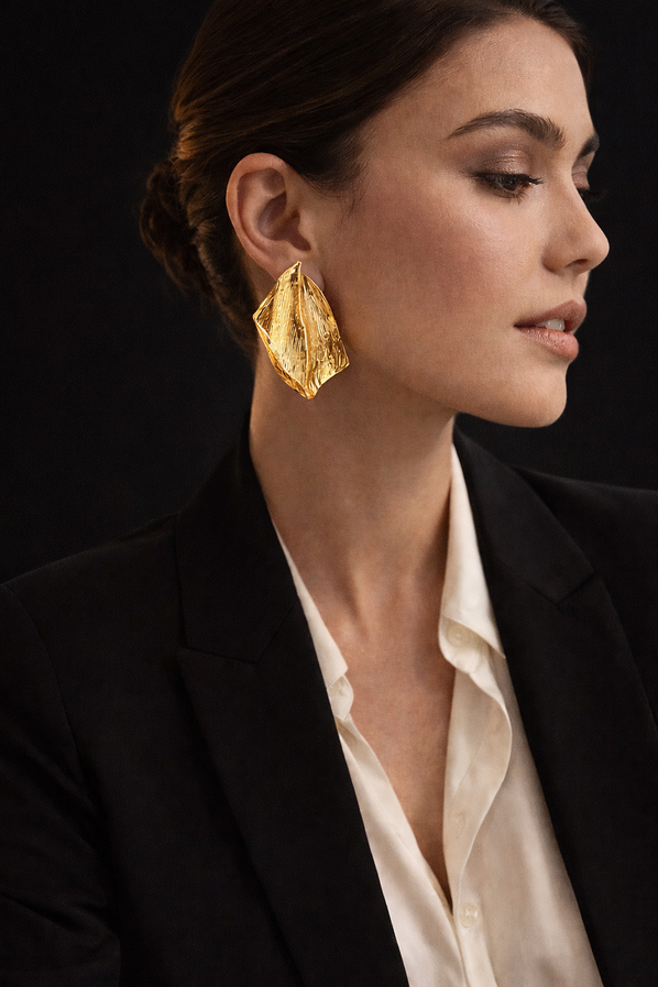 Modern gold statement earrings with folded geometric silhouette