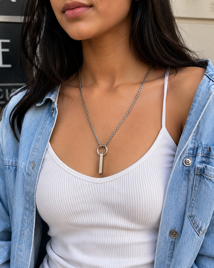 Indian model wearing long ring and bar stainless steel necklace