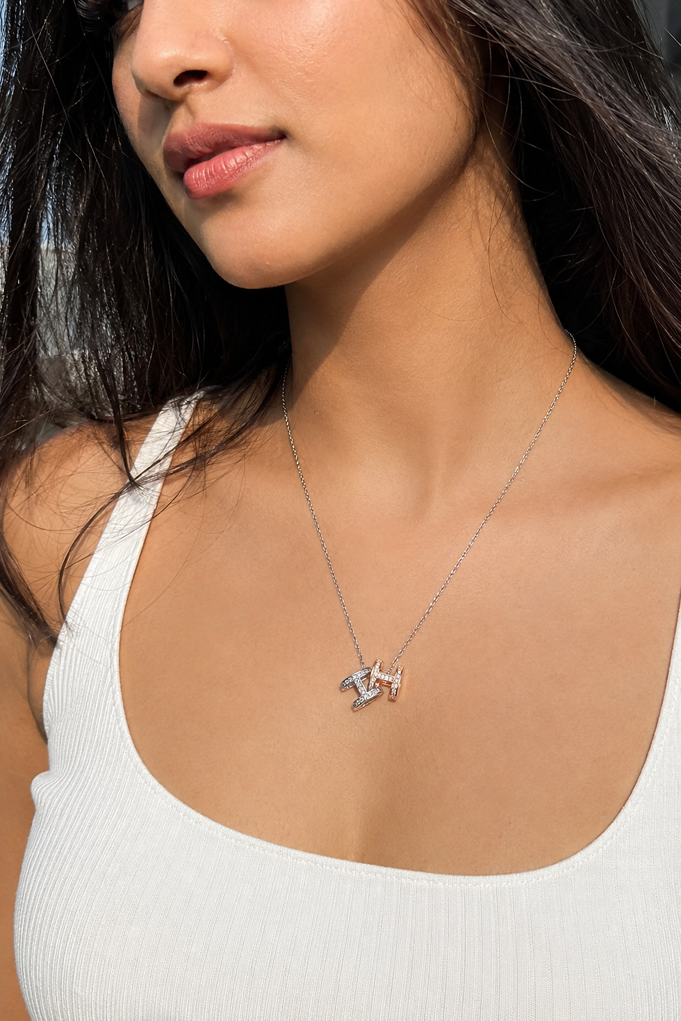 Indian model wearing a stainless-steel double H pendant necklace