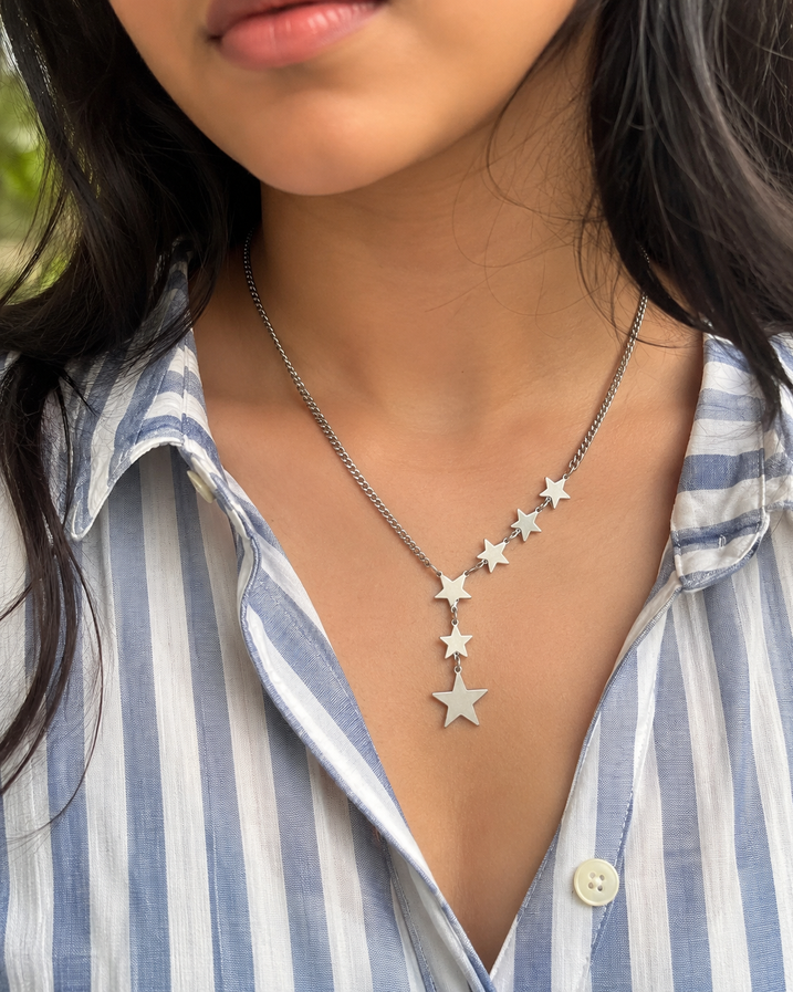 Casual star necklace styled with oversized white shirt