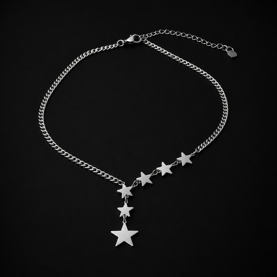 Stainless steel star chain necklace photographed on black background