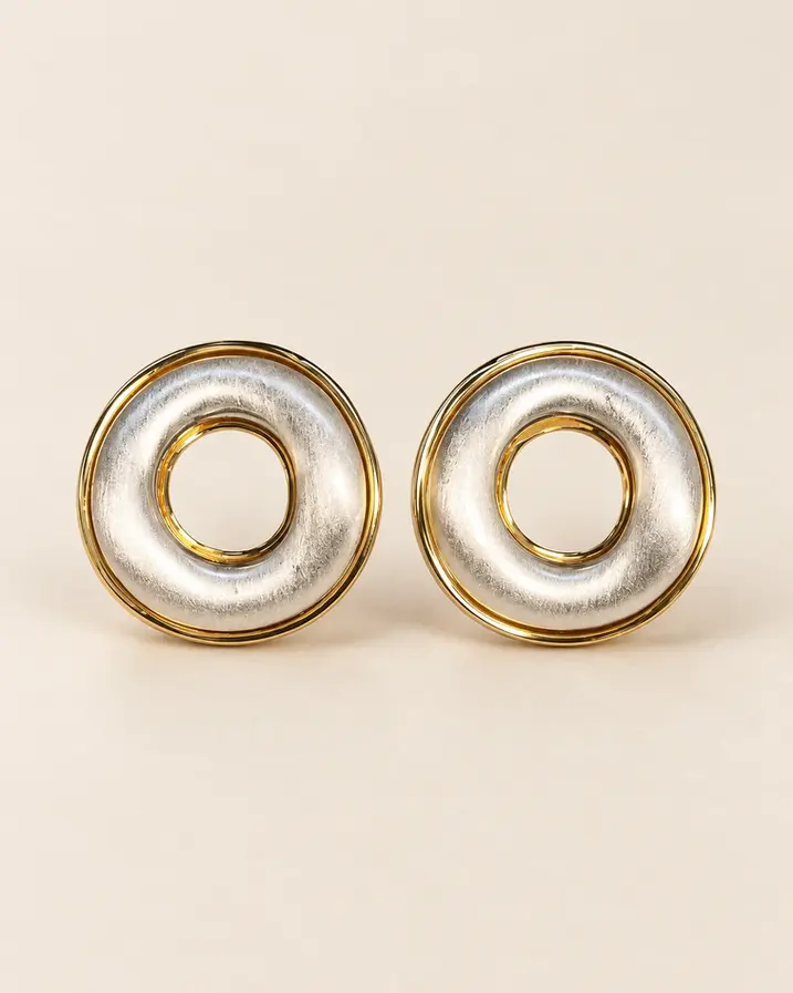 Large sculptural two tone stud earrings with gold plated edge