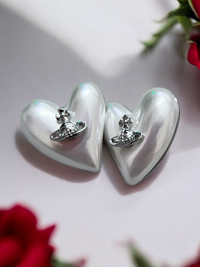 White heart stud earrings with silver crown embellishment