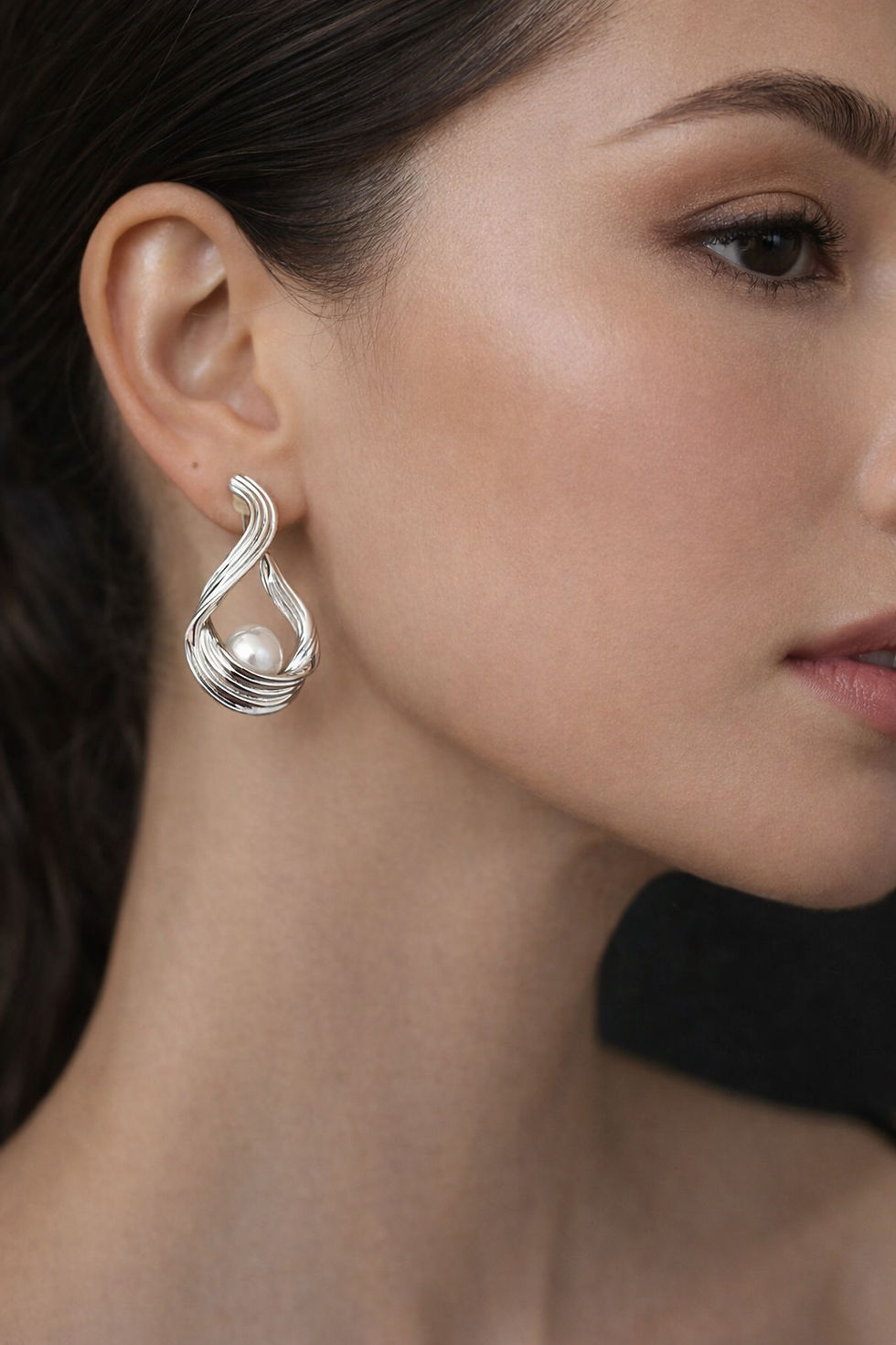 Elegant silver statement earrings with pearl center detail
