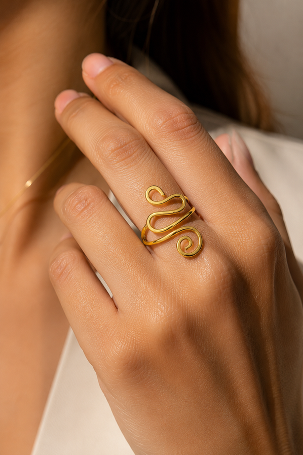 Model wearing adjustable gold snake ring