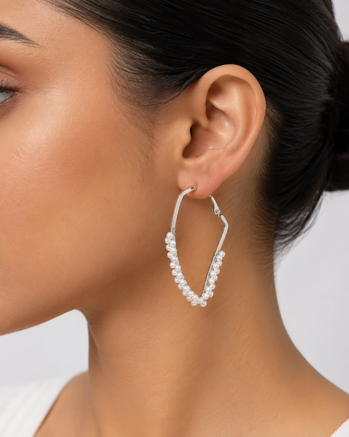 Silver-tone pointed hoop earrings with pearl clusters