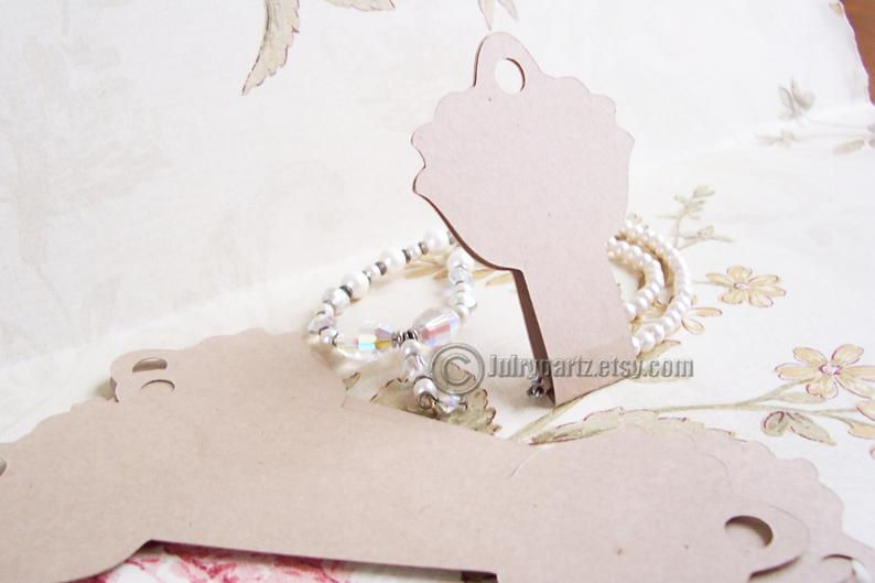 Thumbnail: 64•LOTUS•Hang Tags•2x2.75 inch•NECKLACE HOLDERS•Fold Over Tags•