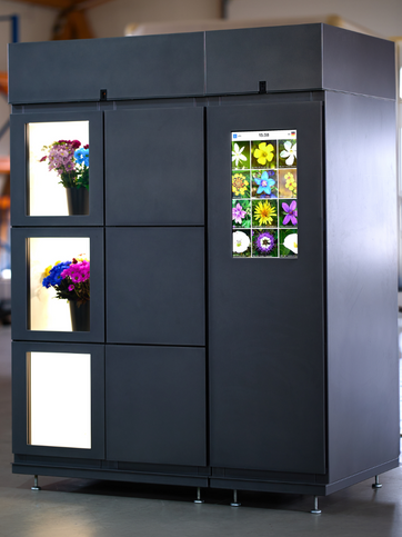 Self-service flower vending machine that allows customers to select flowers independently.