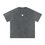 Thumbnail: Flat-lay photo of a gray acid-wash oversized cotton T-shirt featuring a small white Chakana (Inca Cross) symbol centered on